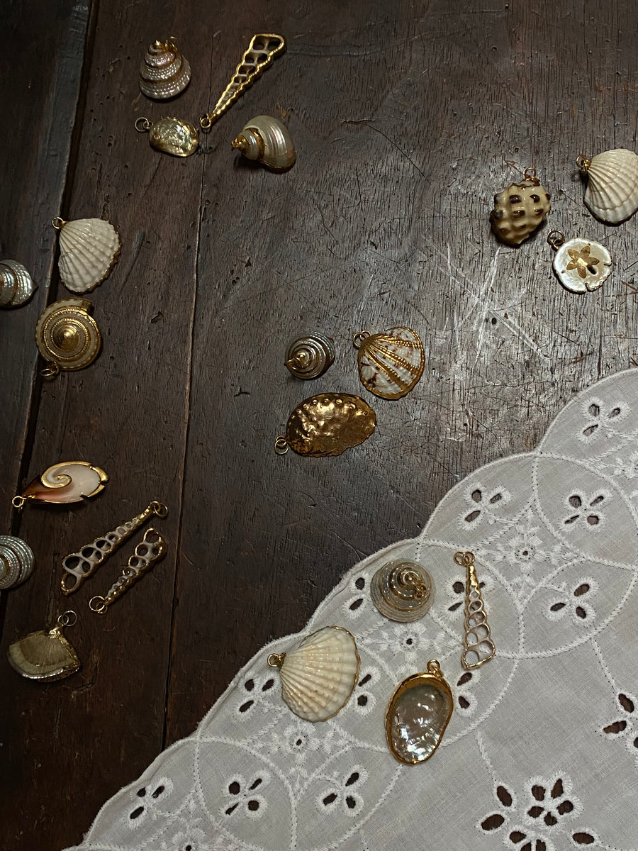 gold trimmed seashell pendants