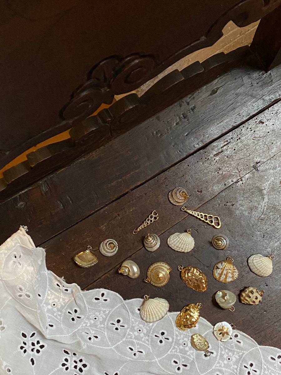 gold trimmed seashell pendants