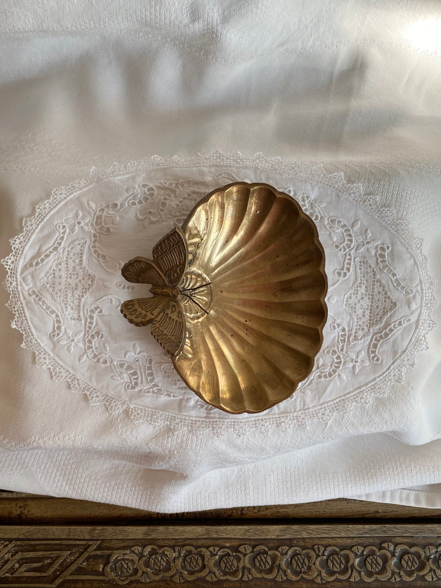 vintage clamshell with resting butterfly