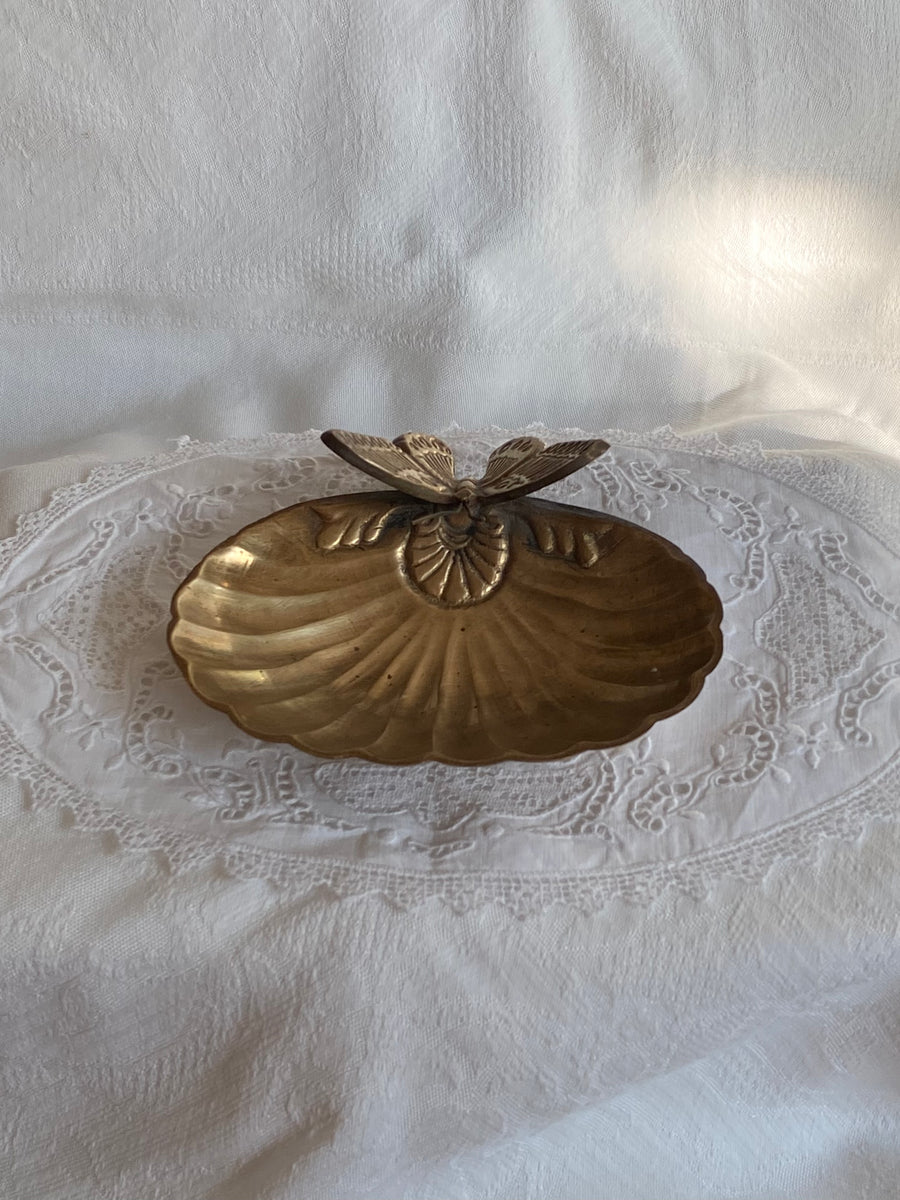 vintage clamshell with resting butterfly