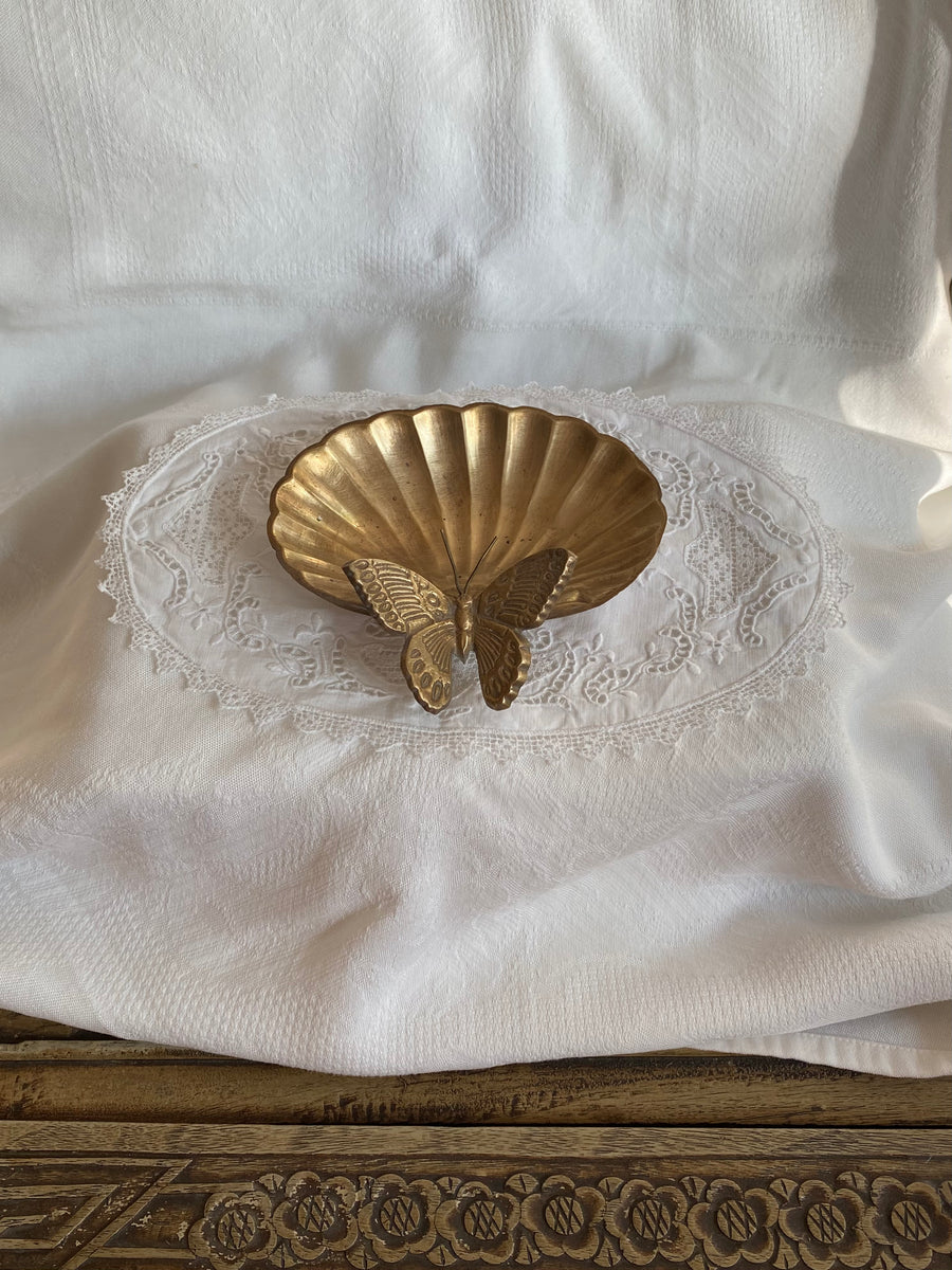 vintage clamshell with resting butterfly